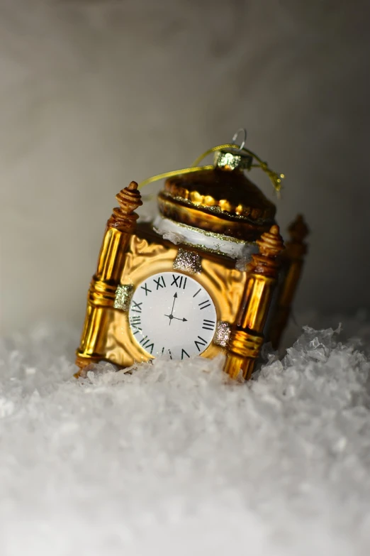 a gold clock sitting on top of a pile of snow, flickr, baroque, tissue ornament, resin, hd —h 1024, photorealistic 35mm