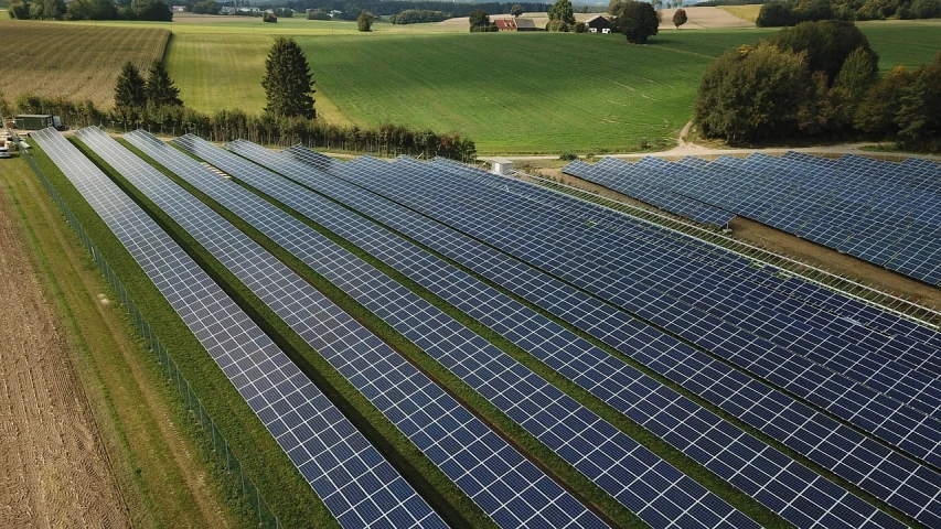 an aerial view of a farm with rows of solar panels, by Karl Völker, shutterstock, 🤬 🤮 💕 🎀, belgium, wide establishing shot, shade