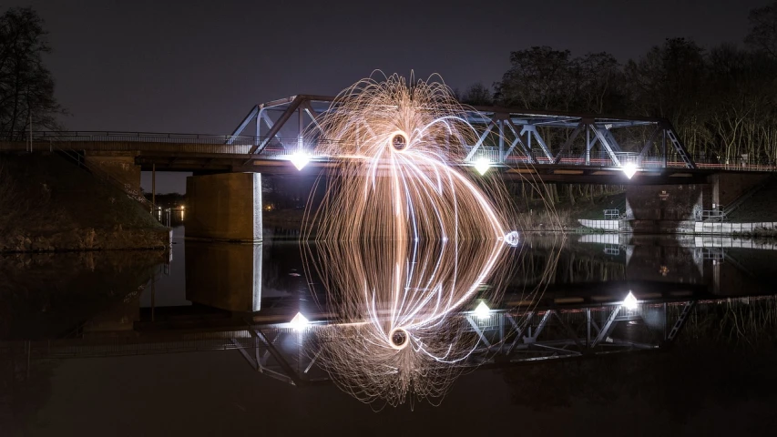 a long exposure photograph of a light painting, metallic bridge, fire reflection, ghost sphere, bagshaw art style