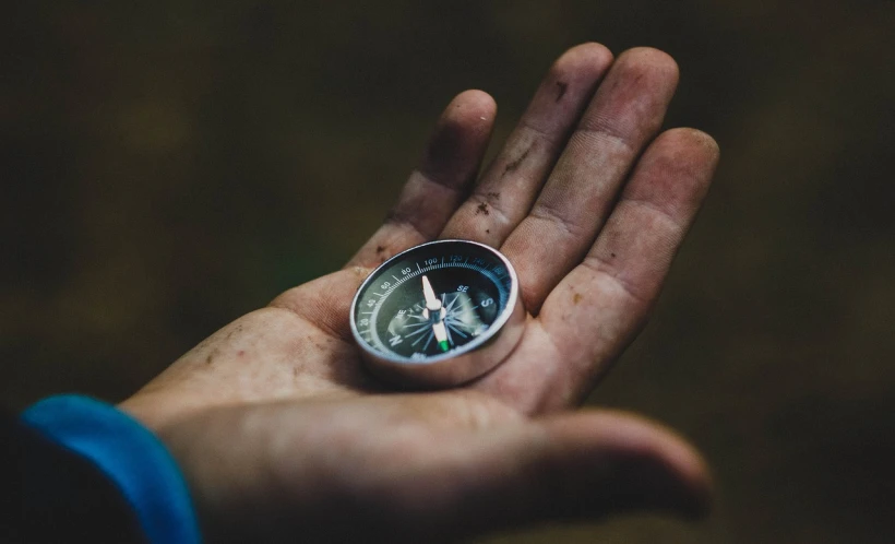 a person holding a compass in their hand, by Adam Szentpétery, unsplash, precisionism, mining, avatar image, messy, profile picture 1024px