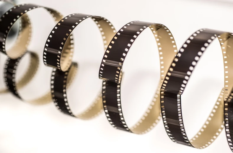 a row of black and white film strips, 4 k product photo, stock photo, celluloid, museum quality photo