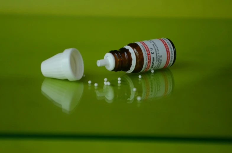 a close up of a bottle of pills on a table, a picture, hyperrealism, product photography 4 k, tear drops, nasal strip, behaelterverfolgung