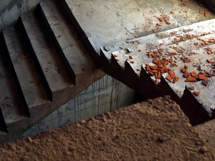 a pile of bricks sitting on top of a pile of dirt, by Arthur Sarkissian, flickr, concrete art, stairs to an upper floor, shattered abstractions, red iron oxide, highly_detailded