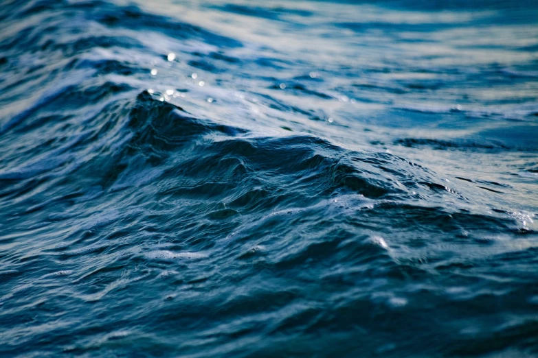 a close up of a wave in the ocean, dark blue water, flickr explore 5 0 mm, kodakchrome : : 8 k, on the calm lake surface