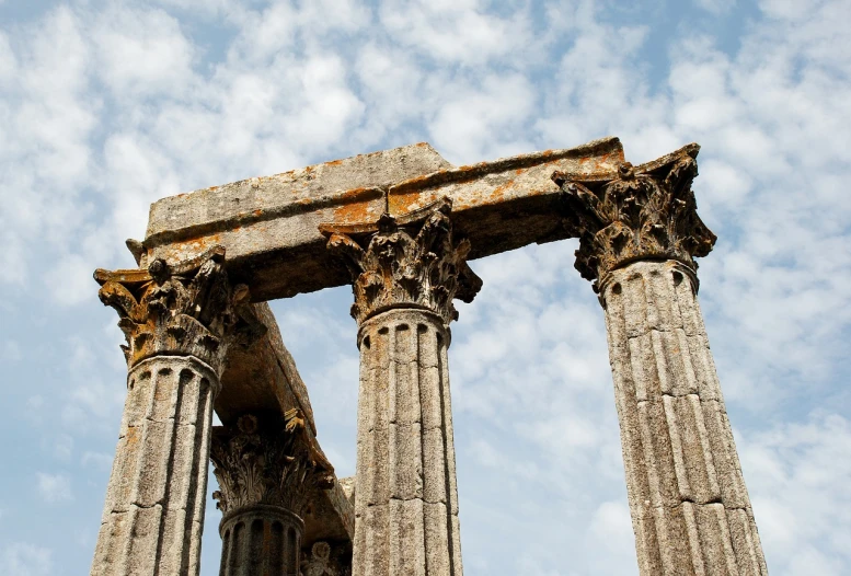 a couple of columns sitting next to each other, flickr, romanesque, ancient greek temple ruins, portugal, istockphoto, moldy