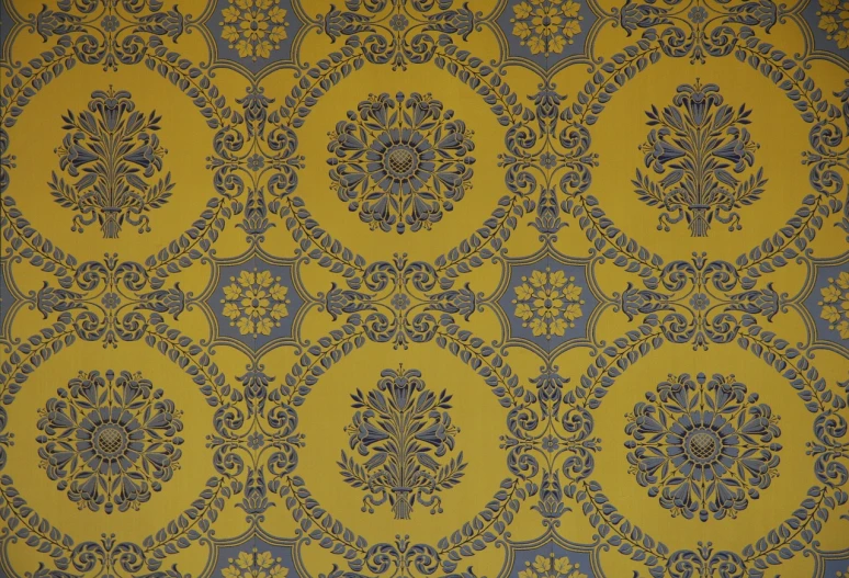 a close up of a yellow and blue wallpaper, a silk screen, inspired by William Yellowlees, baroque, medallion, 1961”, ultra detailed”