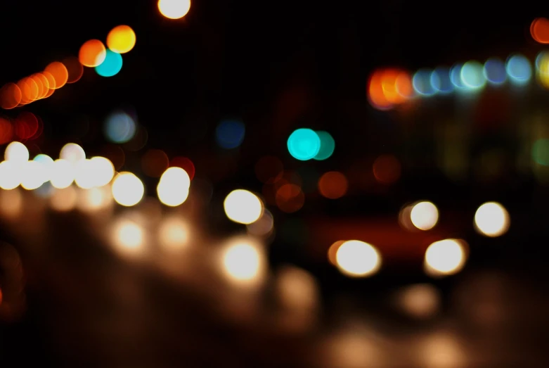 a city street filled with lots of traffic at night, a picture, minimalism, bokeh photo