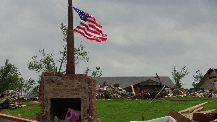 an american flag flying over a pile of junk, a picture, by Robert Childress, flickr, after the storm, oklahoma, reconstruction, not cropped