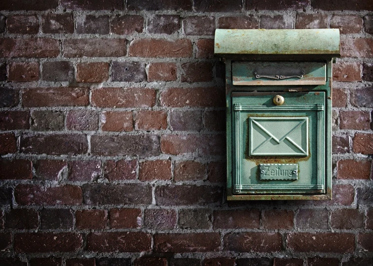 a green mail box on a brick wall, a photo, by Jesper Knudsen, trending on pixabay, smokey burnt envelopes, skybox, key still, background image