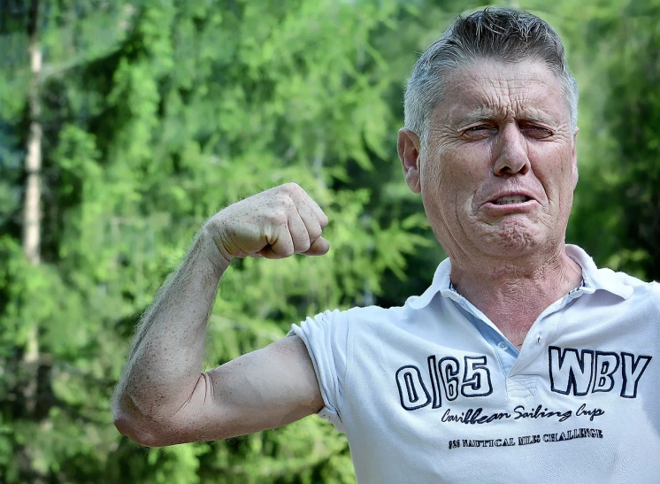 a man flexing his muscles in front of a forest, a photo, by Mirko Rački, pixabay, realism, photo of a 50-year-old white man, man esthete with disgust face, stephen lang, internet meme