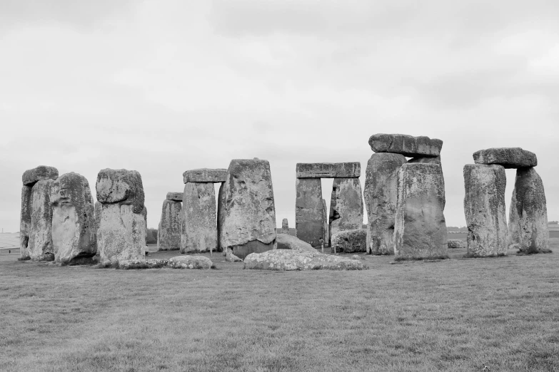 a black and white photo of a large stonehench, by Andrew Bell, unsplash, fine art, ancient technology, wide long view, springtime, twice