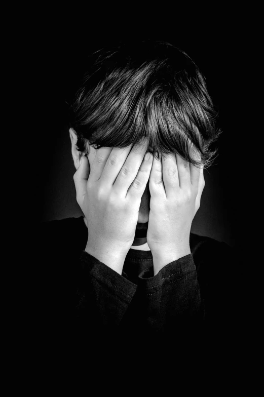 a person covering their face with their hands, a stock photo, pixabay, giga chad crying, black and white image, boy has short black hair, with a hurt expression