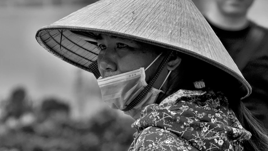 a woman wearing a hat and a face mask, a picture, by Joze Ciuha, pexels contest winner, vietnam, monochrome hdr, macro, !! low contrast!!