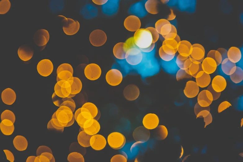 a close up of a bunch of lights, a picture, by Niko Henrichon, pexels, light and space, background yellow and blue, dots abstract, lush tress made of city lights, light circles