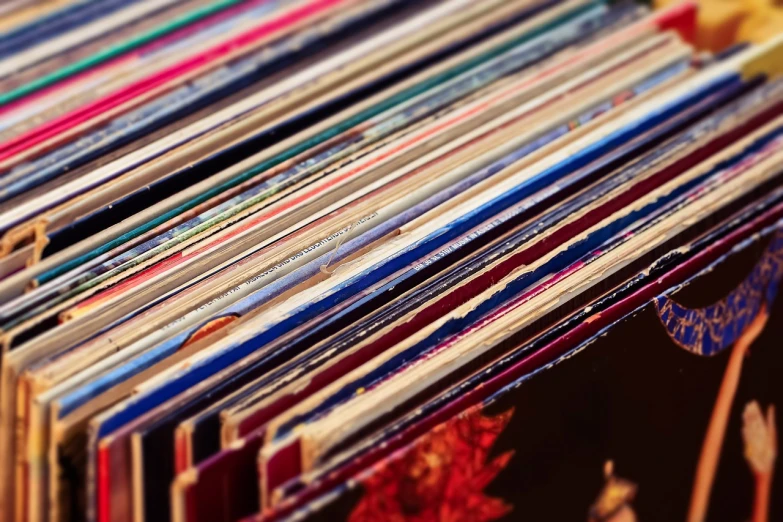 a bunch of records stacked on top of each other, a picture, by Matija Jama, pexels, maximalism, refracted color lines, istockphoto, close up shot from the top, an ancient