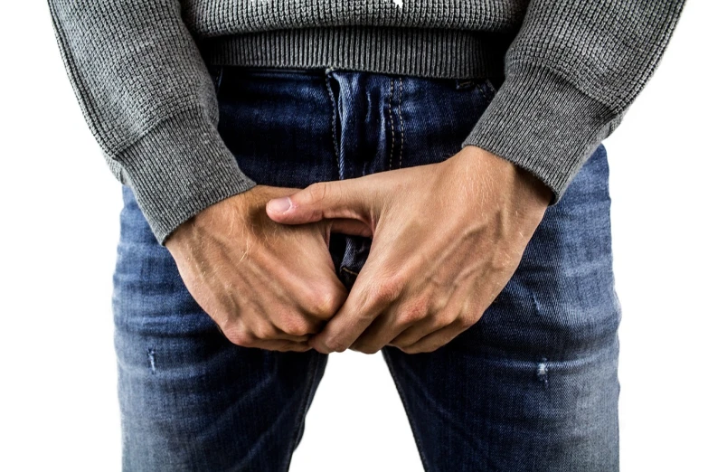 a man with his hands in his pockets, a stock photo, pexels, excrement, point finger with ring on it, gape, realistic''