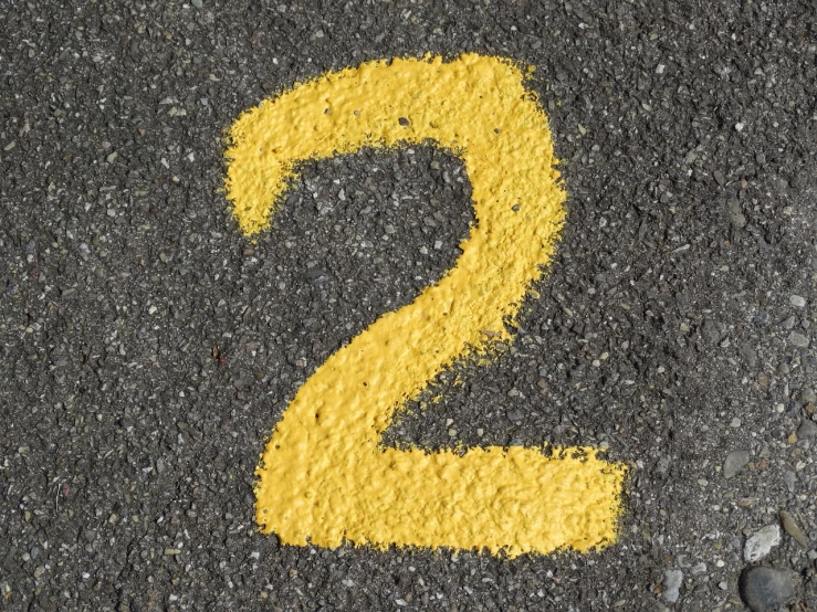 a number two painted on the side of a road, a photo, by Matt Cavotta, pixabay, yellow carpeted, clean post process, two hang, cement
