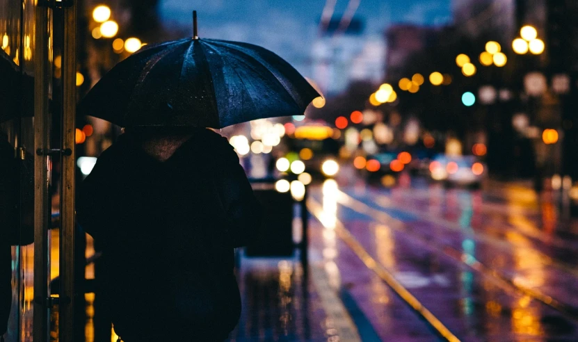 a person standing in the rain with an umbrella, unsplash, realism, city lights, waiting, chillhop, profile picture