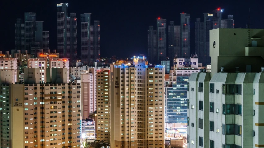 a view of a city at night from a high rise building, jeongseok lee, mass housing, header, basic photo