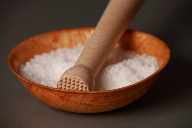 a wooden bowl filled with white salt and a wooden spoon, inspired by Kaigetsudō Ando, shutterstock, sōsaku hanga, ultrafine detail ”, highly detailed product photo, royal, shark