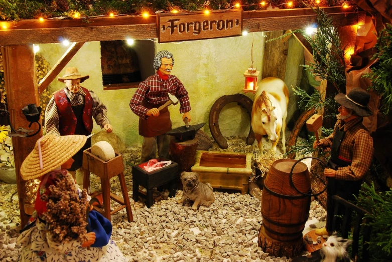 a group of figurines sitting on top of a table, inspired by Pieter Brueghel the Younger, folk art, santa inside a rustic barn, the god of the forge, large diorama, pork