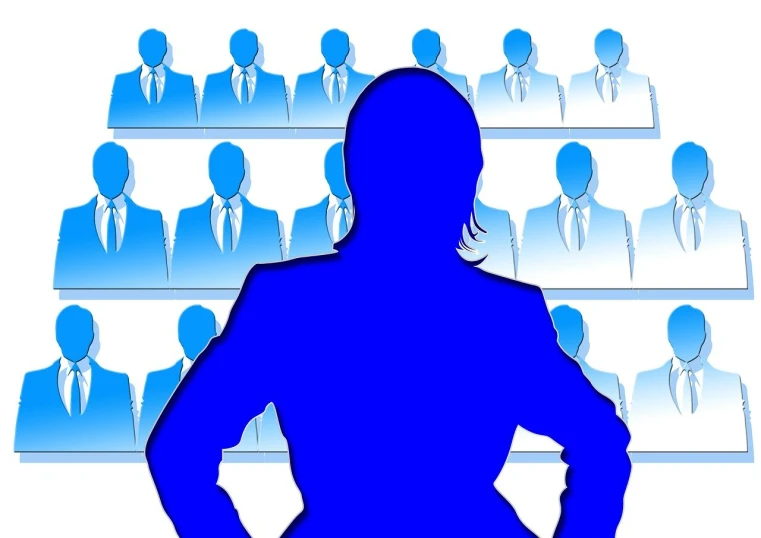 a woman standing in front of a large group of people, a picture, by Allen Jones, pixabay, wearing a blue jacket, outlined silhouettes, presidental elections candidates, female in office dress