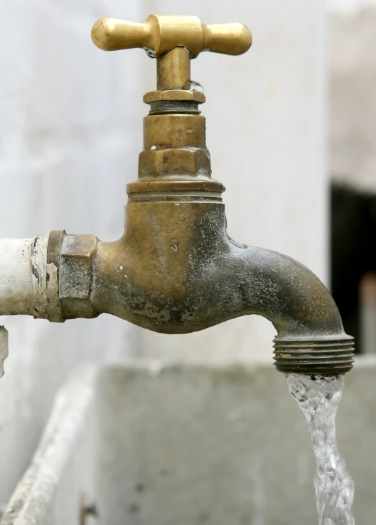 a close up of a faucet with water coming out of it, shutterstock, renaissance, rusty pipes, detailed detailed detailed, 1 9 7 0 s photo