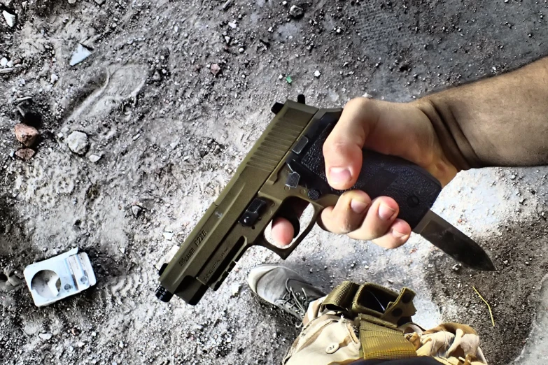 a close up of a person holding a gun, a picture, high quality bug pov shot, youtube video screenshot, airsoft electric pistol, photorealistic - h 6 4 0