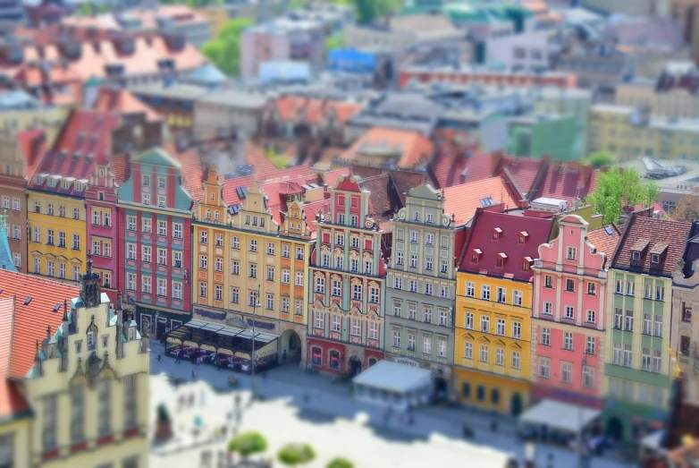 a group of buildings that are next to each other, a tilt shift photo, by Adam Marczyński, renaissance, happy colors dariusz zawadzki, no gradients, market square, high angle close up shot