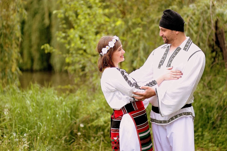 a man and a woman standing next to each other, by Maksimilijan Vanka, shutterstock, ukrainian national clothes, stream of love and happiness, photo shoot, smiling and dancing