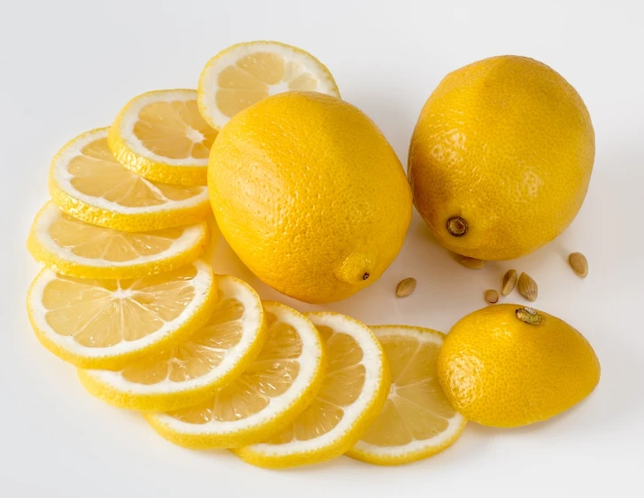 a group of lemons cut in half on a white surface, a picture, renaissance, with a soft, professional product photo, product introduction photo, istock