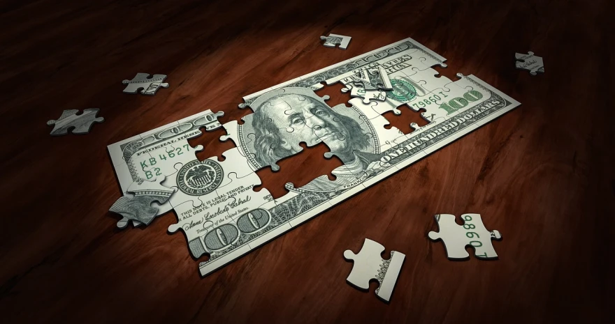 a puzzle piece sitting on top of a wooden table, a digital rendering, by Ben Zoeller, pixabay, digital art, dollar bills, cut-scene, dug stanat, elaborate composition