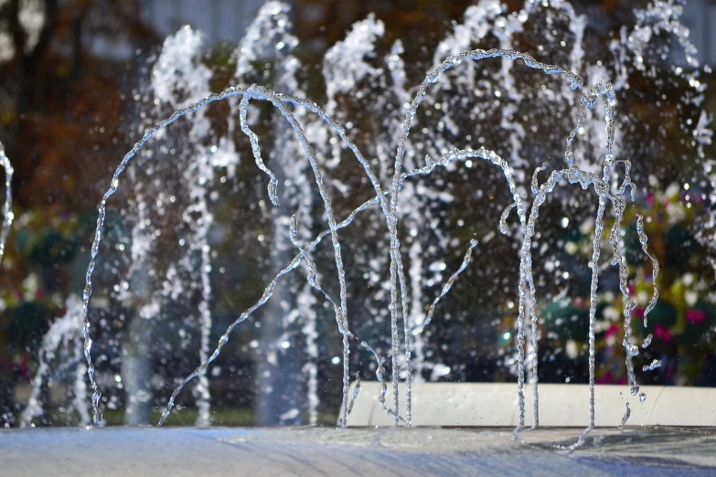 a bunch of water jets coming out of a fountain, figuration libre, winter sun, high quality product image”