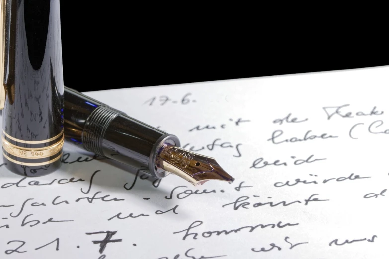 a fountain pen sitting on top of a piece of paper, by Niko Henrichon, romanticism, museum quality photo, full res, with some hand written letters, portlet photo