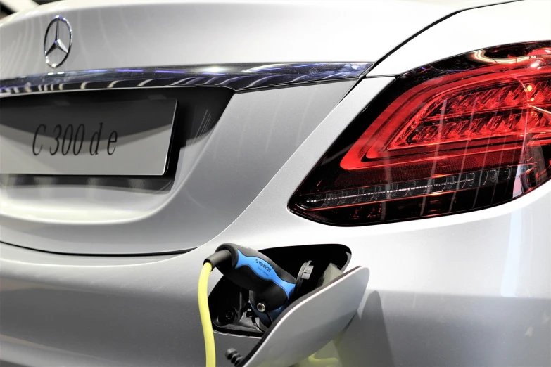 a car with an electric charger plugged into it, shutterstock, pininfarina, très détaillé, associated press photo, mercedes