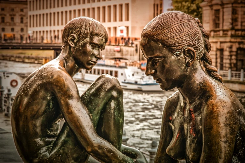 a couple of statues sitting next to each other, by Dietmar Damerau, pexels contest winner, figurative art, at the waterside, intense expression, hdr detail, lesbian