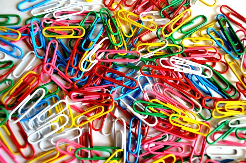 a pile of paper clips sitting on top of a table, a picture, pexels, full of colour 8-w 1024, iphone wallpaper, complex composition!!, colorful - patterns