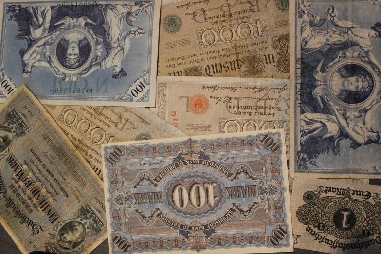 a pile of old money sitting on top of a table, by Abram Arkhipov, pixabay, baroque, 1900s photo, various styles, vintage - w 1 0 2 4, navy