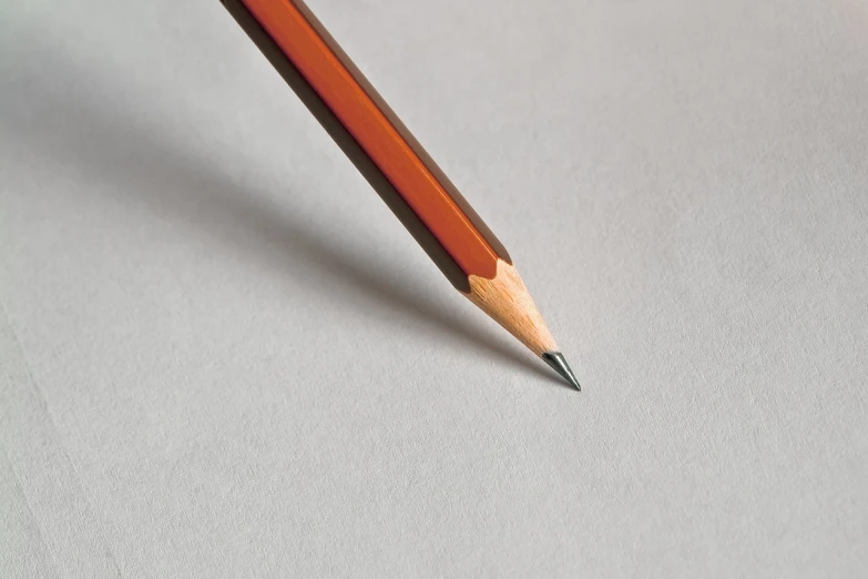 a pencil sitting on top of a piece of paper, a macro photograph, by Jan Kupecký, highly detailed product photo, mid shot photo