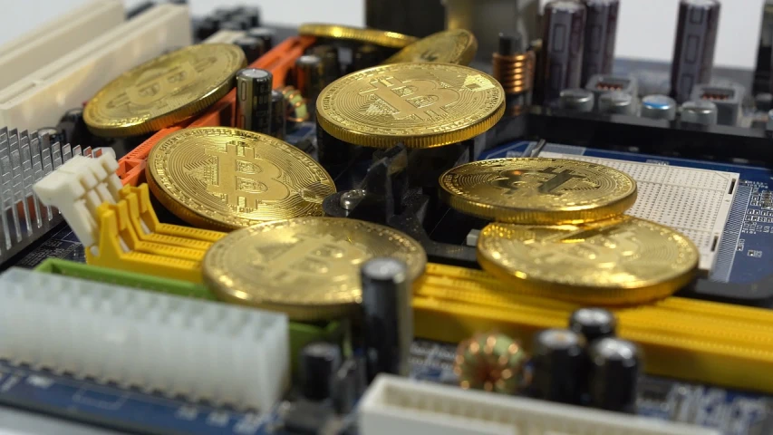 a bunch of gold coins sitting on top of a motherboard, satoshi, zoom shot, konstantin porubov