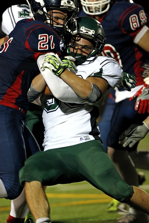 a group of people playing a game of football, shutterstock, utah, green, helmet, dynamic action shot