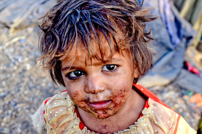 a close up of a child with dirt on her face, inspired by Steve McCurry, uhd candid photo of dirty, iraq nadar, messy eater, portrait”