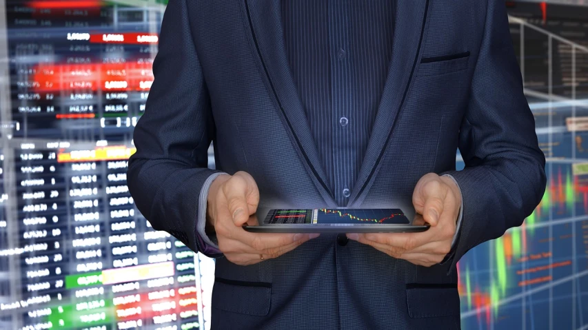 a man in a suit holding a tablet computer, by Kurt Roesch, pexels, digital art, trading stocks, multi-part, vendors, performance