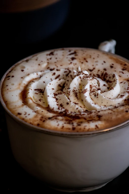 a cup of coffee with whipped cream and chocolate sprinkles, a portrait, by Etienne Delessert, pexels, arabesque, close up shot from the side, fan favorite, soup, chile