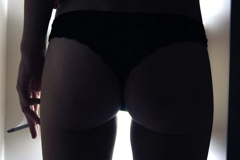 a close up of a person in underwear holding a cigarette, by Thomas Häfner, flickr, silhouette!!!, big booty, webcam, backlit fur