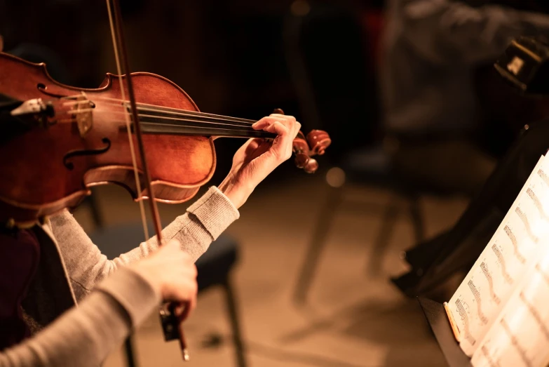 a close up of a person playing a violin, by Anna Haifisch, avatar image, high quality upload, foreground, practice