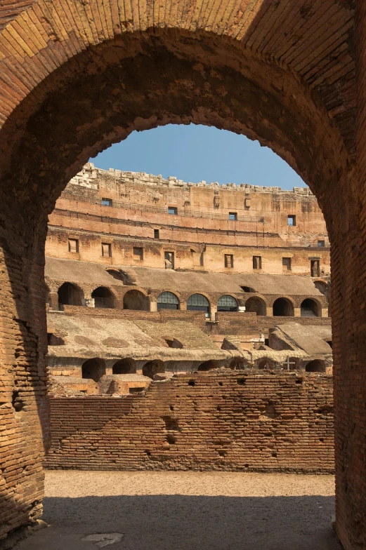 a view of the interior of the colossion in rome, a portrait, shutterstock, stadium, buttresses, warm weather, partially covered with dust