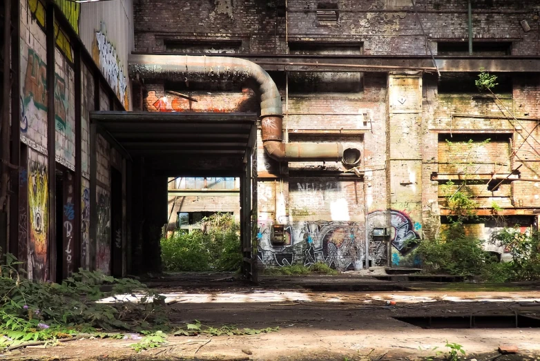 a building that has a bunch of graffiti on it, by Richard Carline, lost place photo, steam pipes, a portal to the depths, hannover