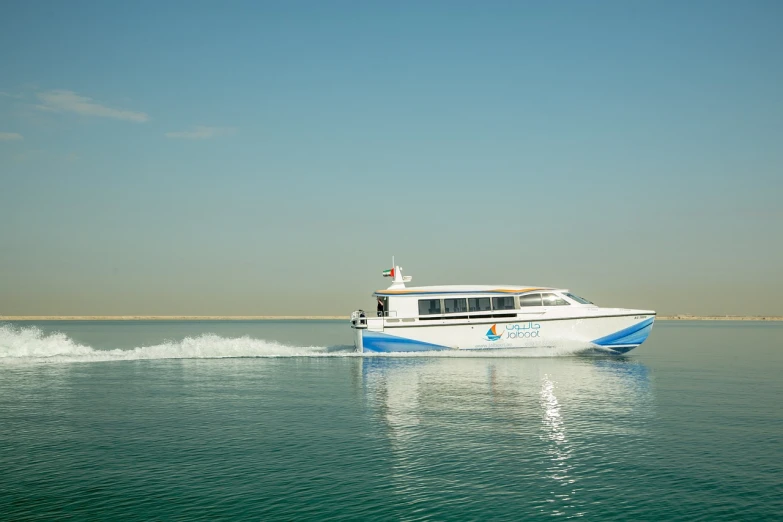 a white and blue boat traveling across a body of water, hurufiyya, hyperspeed, arab ameera al taweel, corporate photo, solaris