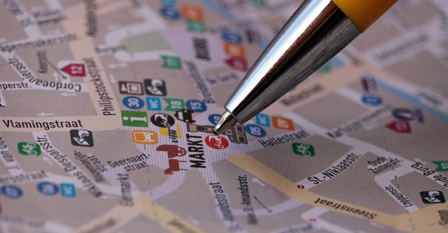 a close up of a pen on a map, by Walenty Wańkowicz, flickr, graffiti, marketing, multiple details, detailed screenshot, vienna